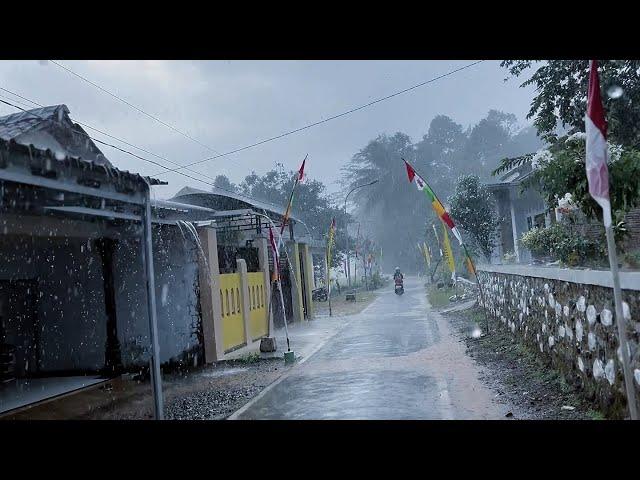 Heavy rain hits villages in Indonesia||walking under the pouring rain||indoculture