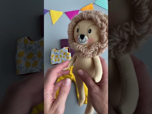 Handmade soft toy lion for children. Textile dolls