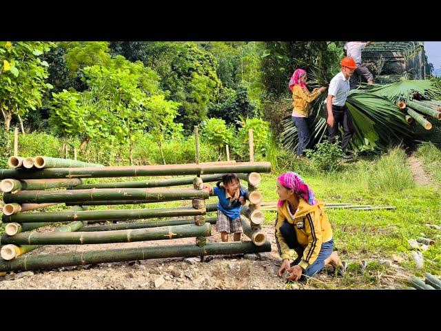 Young engineer brought lots of bamboo and palm leaves to help the mother and daughter build  pig pen