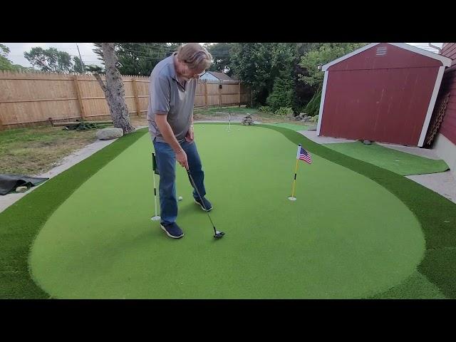 Putting on Star Pro Greens backyard Green.