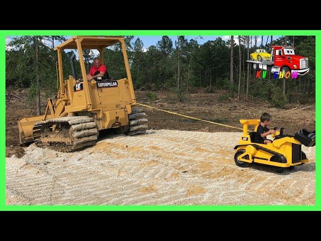 Kruz Helping Dada Powered Ride On Bulldozer Pulling Out The CAT Track Loader Playing Fidget Spinner