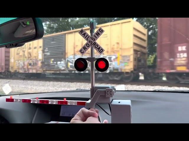 Csx q602 passing through Auburn Alabama with railroad crossing gate toy from 1bdrworkshops