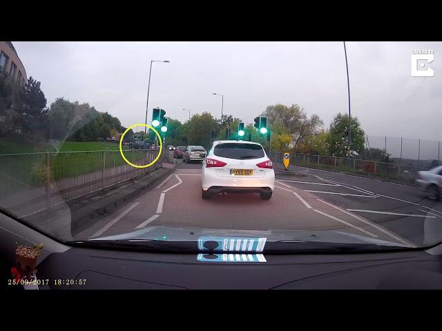 Impatient driver cuts across verge. Video from Caters