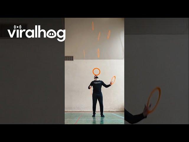 Man Juggles 7 Rings While Balancing One on His Head || ViralHog