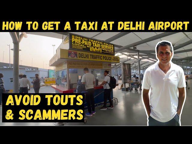 HOW TO GET A TAXI AT DELHI AIRPORT | AVOID THE TAXI TOUTS & SCAMMERS AT DELHI AIRPORT | CATCH A TAXI