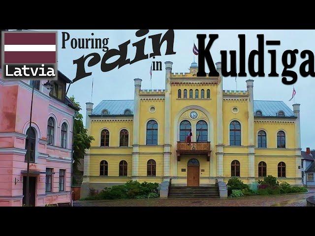 Walking in pouring rain Kuldiga historic old town Latvia UNESCO world heritage