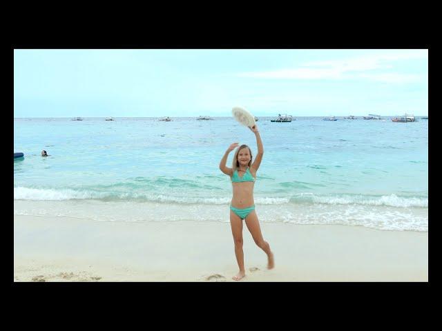 Children playing on the beach 4k. Frisbee.