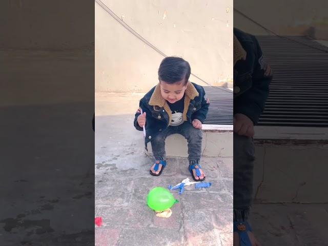 Anaya Enjoying Popping Water Balloon 