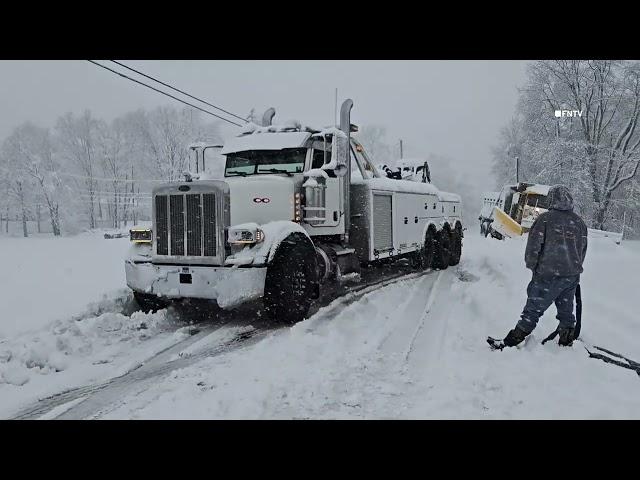 Plow Truck and Other Cars Stuck in Snow in Spring Brook, Pennsylvania