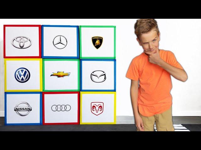 Mark learn popular car brands with cardboard garages