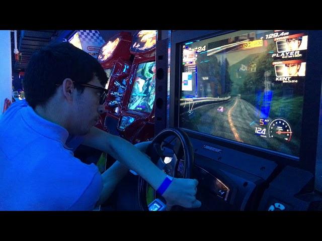 Brother playing Initial D Arcade Stage 4