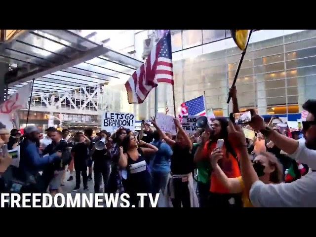 Protesters against vaccine mandates chant "Defund the Media" in front of the New York Times building