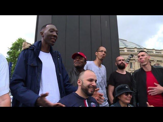 World's tallest people stroll the streets of Paris