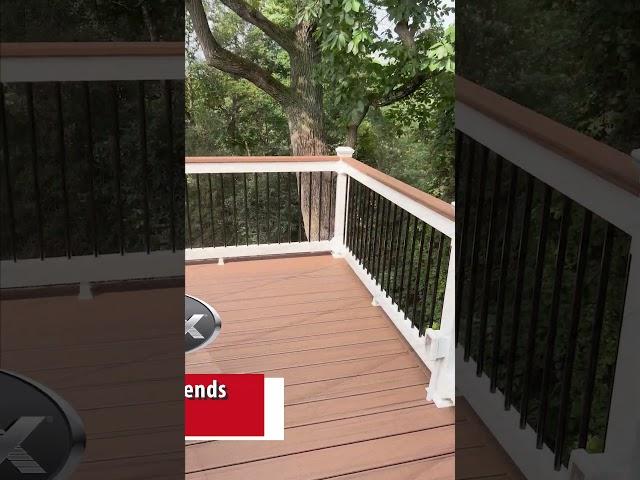 Tropical-Inspired 2-Level Deck | Trex Transcend Tiki Torch Composite Deck | Fence & Deck Connection