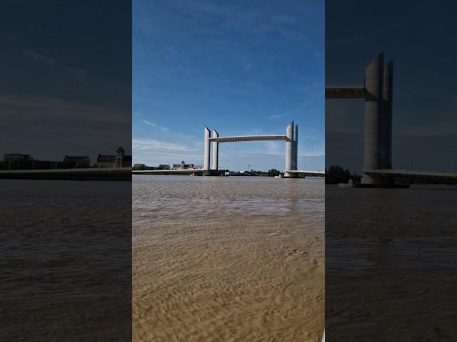 Sailing under fully raised Jacques Chaban Delmas bridge in Bordeaux 