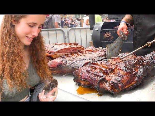 Street Food Festival in Spain. Orgy of Juicy Pork Loin Roasted and Cut. Meat&Fire Event, Barcelona