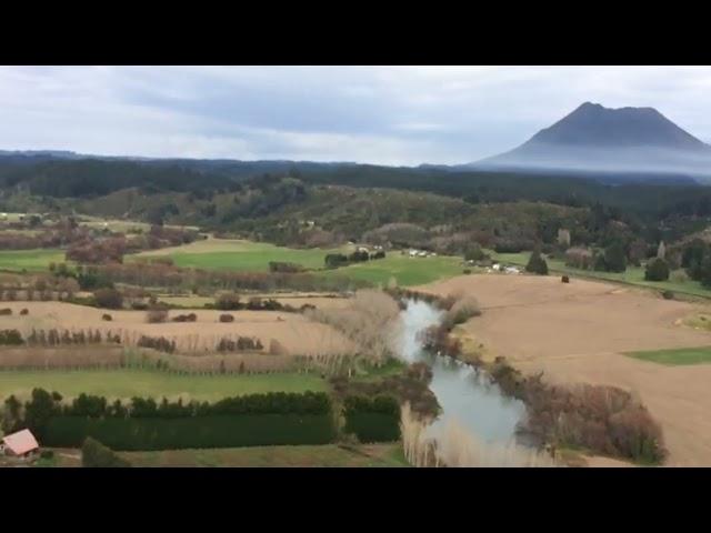 flying over Te Teko Whakatane orchard to clean hail net with spray