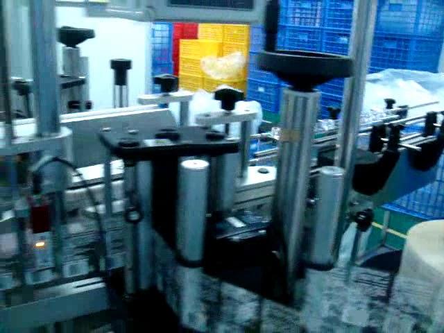 double sides labeling machine for flat bottle ）with transparent labels -Abby Huang China