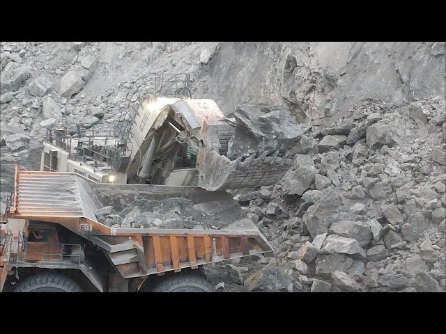 Loading Big Chunks of Rocks Liebherr R9350 Excavator Loading the Dump Truck With Big Copper Rocks