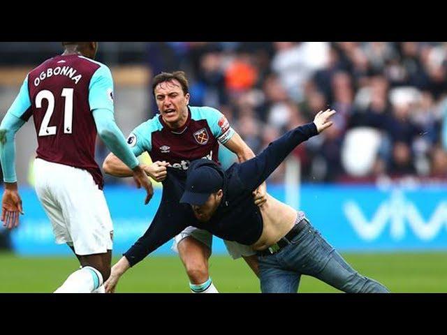 MARK NOBLE PUSHES A WEST HAM FAN TO THE GROUND