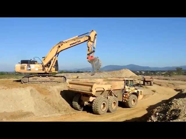 Big excavators on construction sites...Cat, Komatsu, Liebherr...