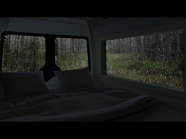 Rain on windows of car for camping in forest | car camping