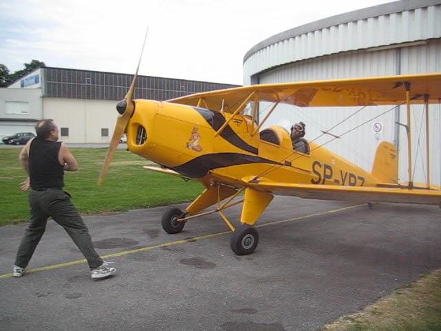 Hand Propping Vintage Biplane, Buecker 131 Jungmann Walter Minor Motor.