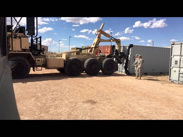 M1075 PLS loading a conex