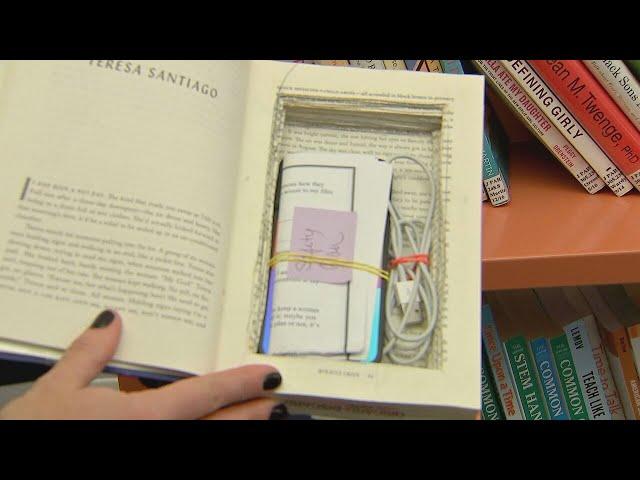 Local librarian hides cell phones in books to help domestic violence victims