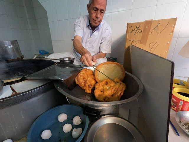 #TunisianStreetFood About 100  years old Tunisian "Beignet" or Ftayir Tunisian  in medina, Sfax