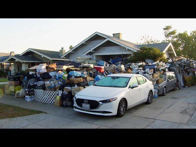 Hoarder’s Yard Has 8-Foot-Tall Wall of Junk