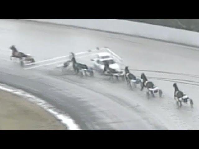 Accident at Freehold Raceway track involving horses and a pace car