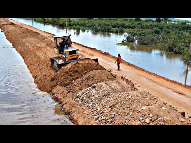 Wonderful repairing road construction Technology by komatsu dozer with dump truck unloading soil.