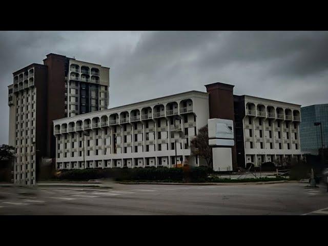 Exploring THE MOST DANGEROUS abandoned hotel in Dallas [HELD AT GUNPOINT!]