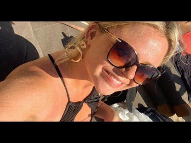   Emily Atack risks wardrobe malfunction in completely open swimsuit