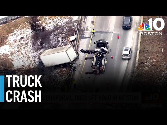 Box truck crashes through guardrail in Weston