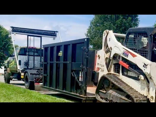 Hauling a Skid Steer in a Dumpster