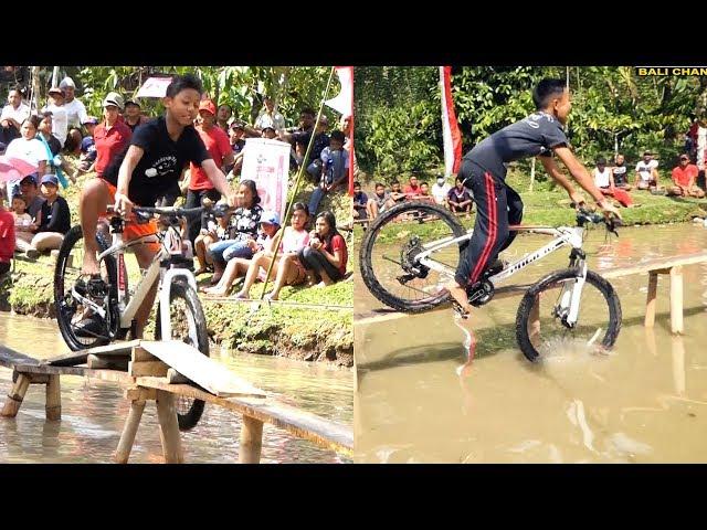 Cycling Competition On Pond farm fish on Indonesia Independence Day