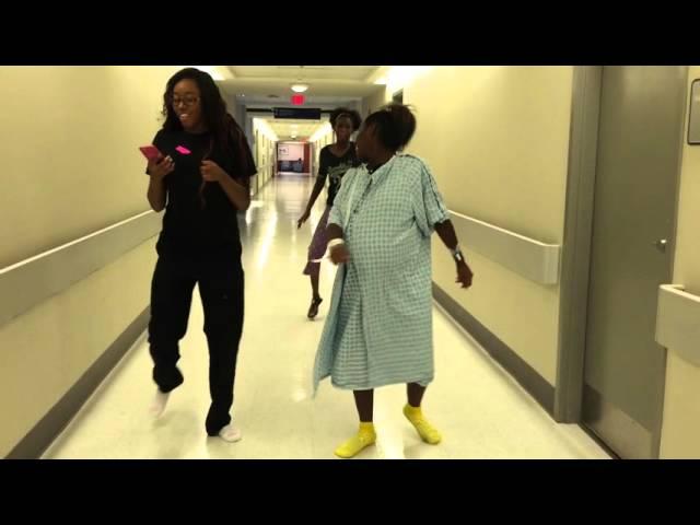 Mommy dancing baby down between contractions