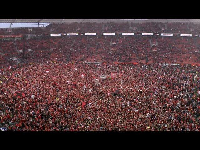 The moment Bayer Leverkusen fans stormed the pitch after winning their first ever Bundesliga