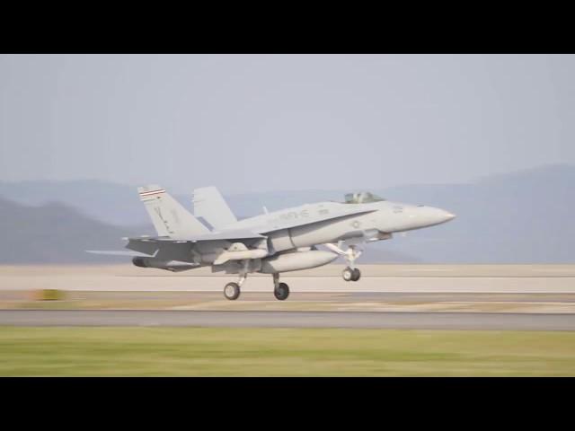 USMC F/A-18C Hornets training with anti-ship missile AGM-84 Harpoon