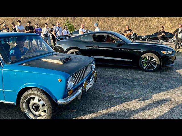 amateur driving a VAZ 2102 versus rich people driving expensive cars