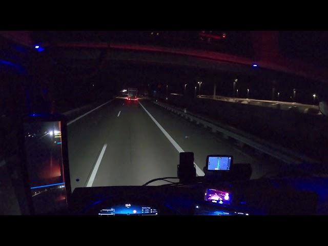 POV Driving Mercedes Actros Gigaspace 1848 in Germany .  Driving at night. Cockpit view 4K