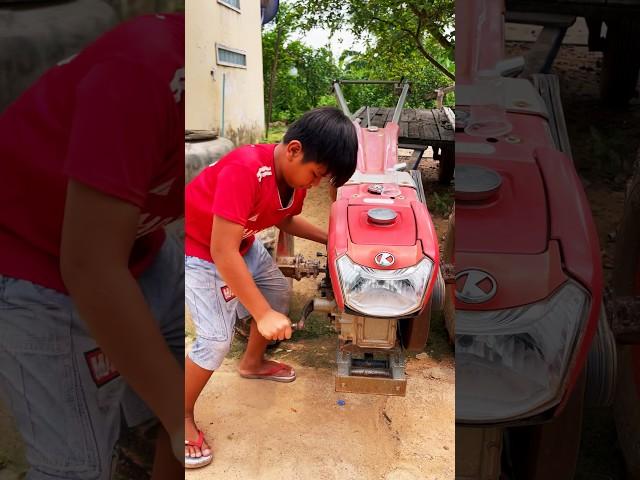 The young boy with Kubota