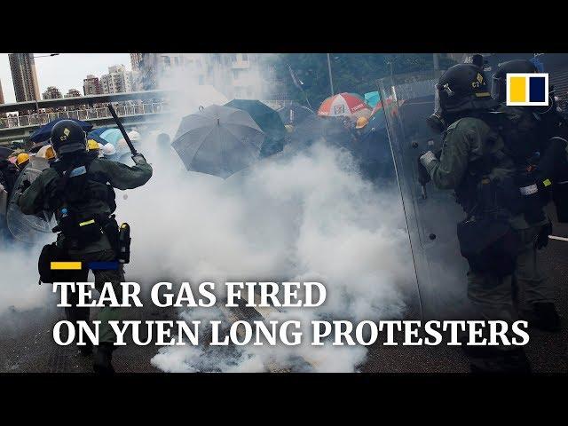 Police fire tear gas at Hong Kong protesters in Yuen Long, as tens of thousands join illegal march