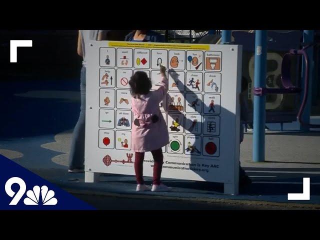 Communication board set up at playground to help nonverbal kids communicate, make friends