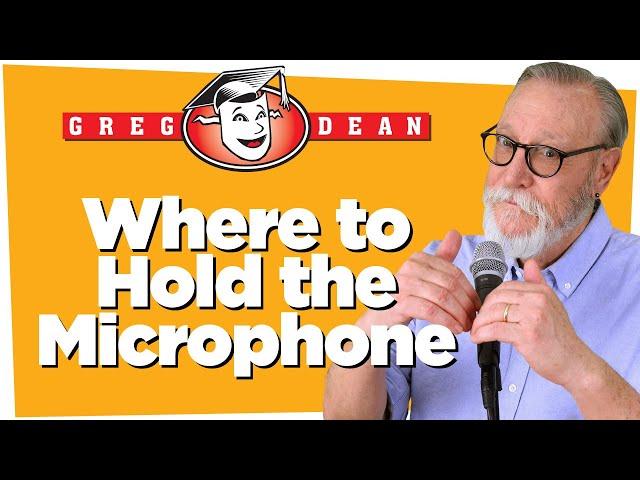 Holding a Stand Up Comedy Microphone - Classes Greg Dean Tips Comedians Shows