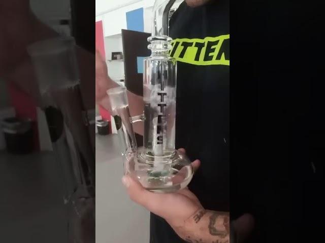 Glass bong, vape, grinder, liquid.One stop solution for smoking—The Green Vapor.