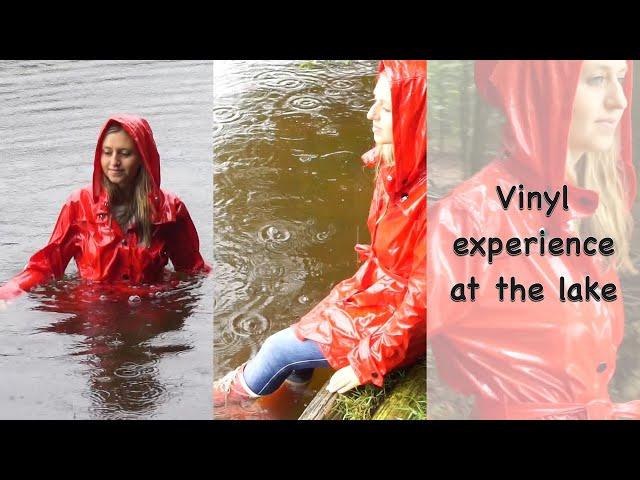 Blonde girl swimming in rainwear - wet clothes, wet boots, wet rainwear