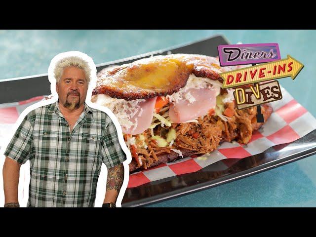 Guy Fieri Eats a Patacon Beef Sandwich | Diners, Drive-Ins and Dives | Food Network